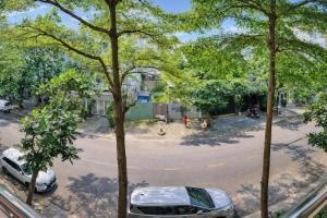 a view from a window of a street with trees at Minh Hà Hotel Hồ Chí Minh in Ho Chi Minh City
