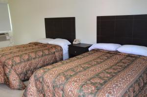 Cama o camas de una habitación en Carl's El Padre Motel