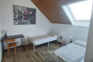 Postel nebo postele na pokoji v ubytování Ferienhaus in Pertersaurach-Langenloh bei Nürnberg