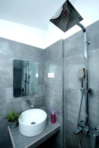 a bathroom with a sink and a shower at Kandy House Hiriketiya in Dickwella +168 photos