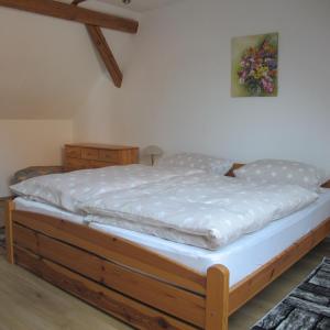 Giường trong phòng chung tại Ferienwohnungen Pustane +37 ảnh