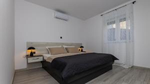 En eller flere senge i et værelse på Villa Klara - Makarska by Villas Guide + 26 billeder