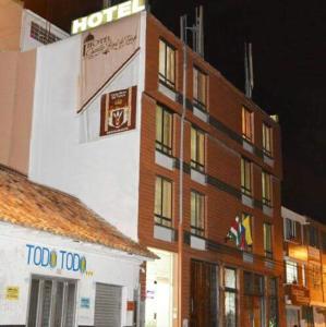 a building with a hotel sign on top of it at Hotel Castillo Real in Tunja