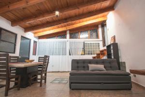 a living room with a couch and a table at Casa Palomar in Guanajuato