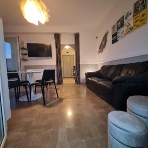 a living room with a couch and a table at Ocean View House in Nettuno