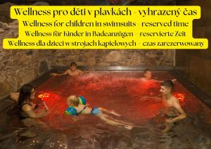 a group of people bathing in a hot tub at Hotel Kocourkov in Hlinsko