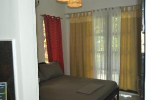 En eller flere senge i et værelse på Andrei Holiday House