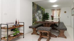 a dining room with a table and some plants at Star Hill - Makarska by Villas Guide in Slivno