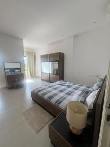 En eller flere senge i et værelse på Tchikobo hola