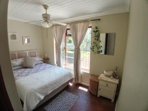 Postel nebo postele na pokoji v ubytování Starfish Cottage