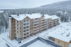 an aerial view of a building in the snow at Levillas Lingonberry D26 in Levi