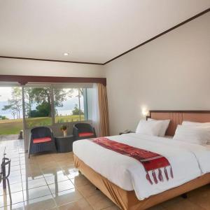 Giường trong phòng chung tại Hotel Patra Parapat
