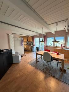 a large room with a table and a kitchen at Momo Den in Blomberg