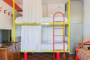 En eller flere senge i et værelse på Hostdomus - Ski Golf