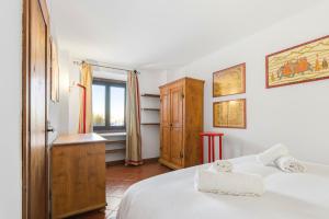 En eller flere senge i et værelse på Hostdomus - Ski Golf