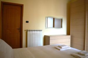 Postel nebo postele na pokoji v ubytování Homiday - Appartamento Sant'Agnese