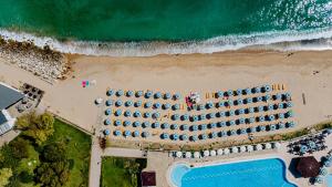 an overhead view of a beach with a lot of umbrellas at HVD Riviera Beach Ultra All Inclusive & Mineral Pool - Private Beach & Free Parking in Golden Sands +40 photos