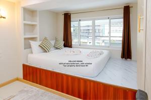 En eller flere senge i et værelse på PSA Palace Khaosan