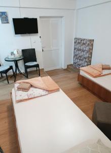 En eller flere senge i et værelse på Soba Angelina Međugorje