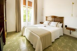 En eller flere senge i et værelse på Habitacion Camagroc