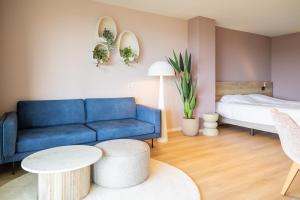 Postel nebo postele na pokoji v ubytování Strandhotel Buren aan Zee