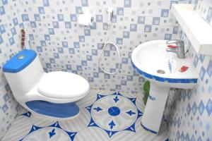 ein Badezimmer mit Toilette und Waschbecken in der Unterkunft Rhino Apartments in Watamu