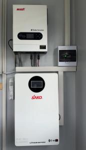 a sana appliance sitting on top of a refrigerator at Uduak Lodge in Harare