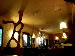 a restaurant with people sitting in a room with lights at Hostel Mostel Sofia in Sofia