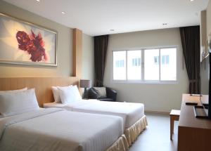 Letto o letti in una camera di PP Charlie Beach Resort