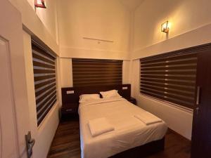 Giường trong phòng chung tại Carrot Creek Resorts