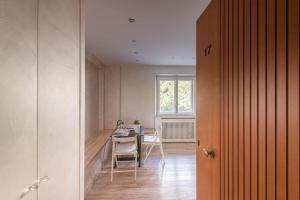 a room with a table and a chair and a window at La Casina in Terminillo