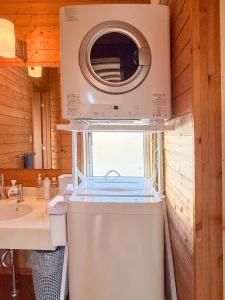 a kitchen with a washing machine and a sink at yado suzuka in Suzuka +68 photos
