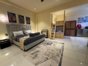 a large bedroom with a bed and a rug at Mzion Hotel Weligama in Weligama