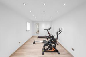 a gym with two exercise bikes in a room at Gîte Perce Neige, Spa, Sauna in Gerbépal +4 photos