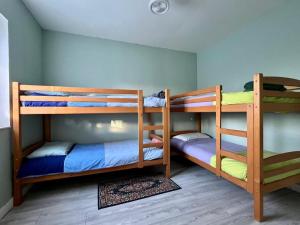 a room with two bunk beds in a room at Maison David in Le Buis