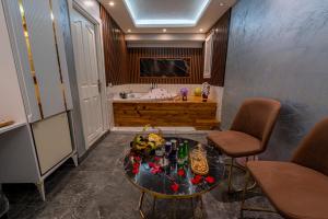 a bathroom with a table and a bath tub at Stay Suite Hotel in Istanbul