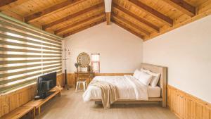 Et tv og/eller underholdning på Gangneung Sinami68 Pension