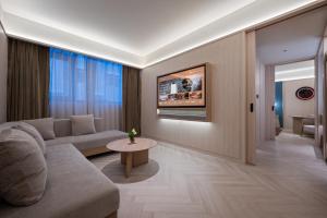 Posezení v ubytování Orange Crystal Hotel Nanjing Jiangning Sasseur Southeast University