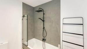 a shower in a bathroom with a glass door at Modern apartment near City Centre, Luna CasaMia in Mellet +9 photos