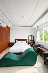 En eller flere senge i et værelse på Mio Hotel Vũng Tàu + 46 billeder