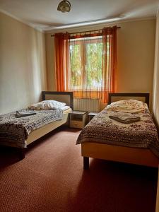 Giường trong phòng chung tại Gościniec Wstąp TU