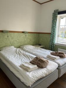 Postel nebo postele na pokoji v ubytování Spa For Hjo + 3 fotografie