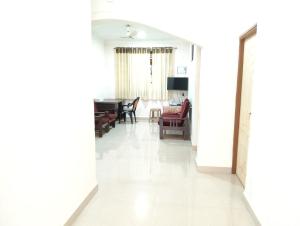 a hallway with a living room and a dining room at Richnest Apartment and villas Colva in Colva