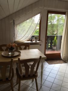 a dining room with a table and a window at Ferienhaus Haber in Schluchsee