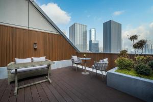 Balkón nebo terasa v ubytování Orange Crystal Hotel Nanjing Jiangning Sasseur Southeast University