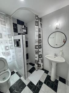 a bathroom with a toilet and a sink at Cozy Stay in Ban Nong Waeng +20 photos