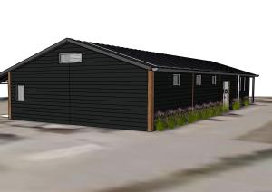 un grande edificio nero con dei fiori davanti di De Hombrake, Bed & Breakfast a Wilp