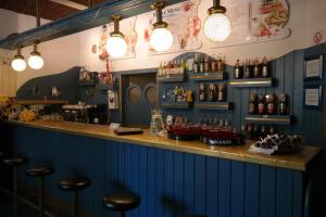 a bar with bottles of alcohol on the counter at Apartamenty Marco - Stare Miasto - Super Wi Fi in Krakow