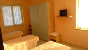 TV a/nebo společenská místnost v ubytování La Quercia Hotel con Ristorante