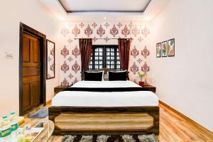 En eller flere senge i et værelse på Hotel O SPRINGWOODS HOSPITALITY